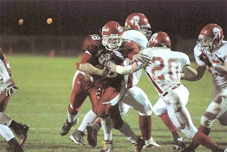 M-P senior running back Austin Denton carries the ball into the end zone