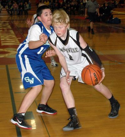 Caleb Koellmer drives toward the basket against Shorewood on March 2.