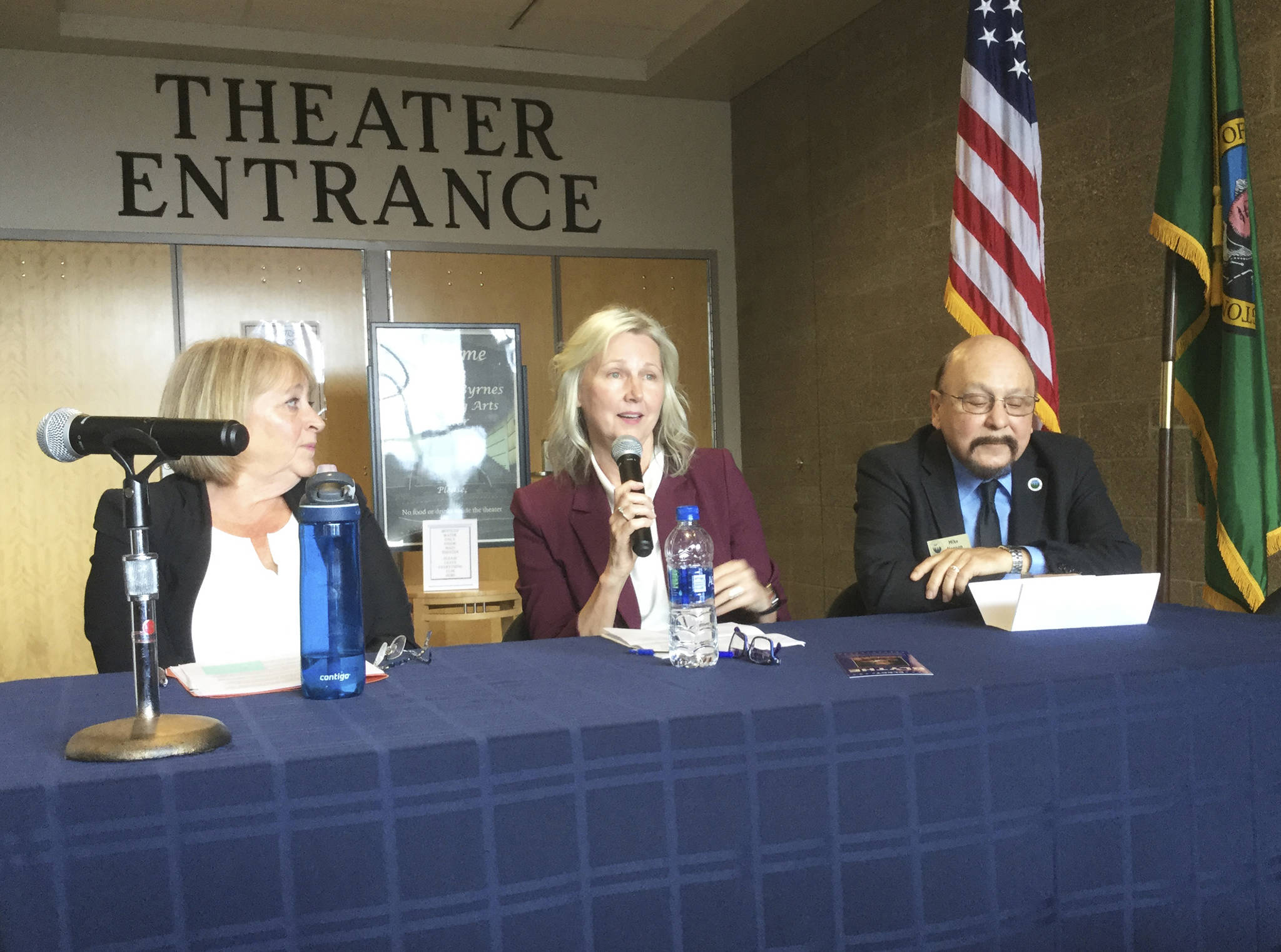 Arlington City Council candidate Michele Blythe answers a question at a forum Tuesday hosted by the Stillaguamish Valley Chamber of Commerce. Also pictured are incumbent Mayor Barb Tolbert and unopposed City Councilman Mike Hopson.