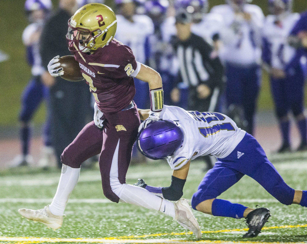 Carson Chrisman goes in for one of his three scores against Sequim. (Olivia Vanni/The Herald)