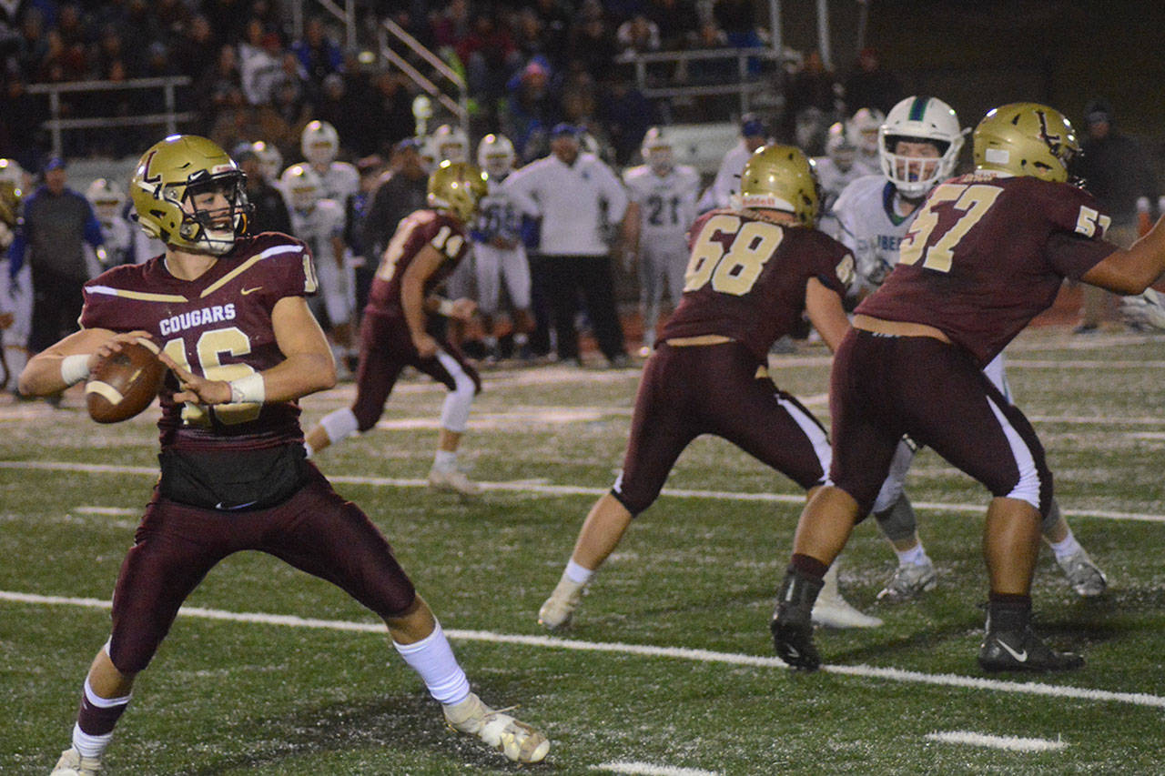 Jared Taylor of Lakewood gets set to pass in a recent game. Taylor had some highs and lows against Hockinson. (Steve Powell/Staff Photo)