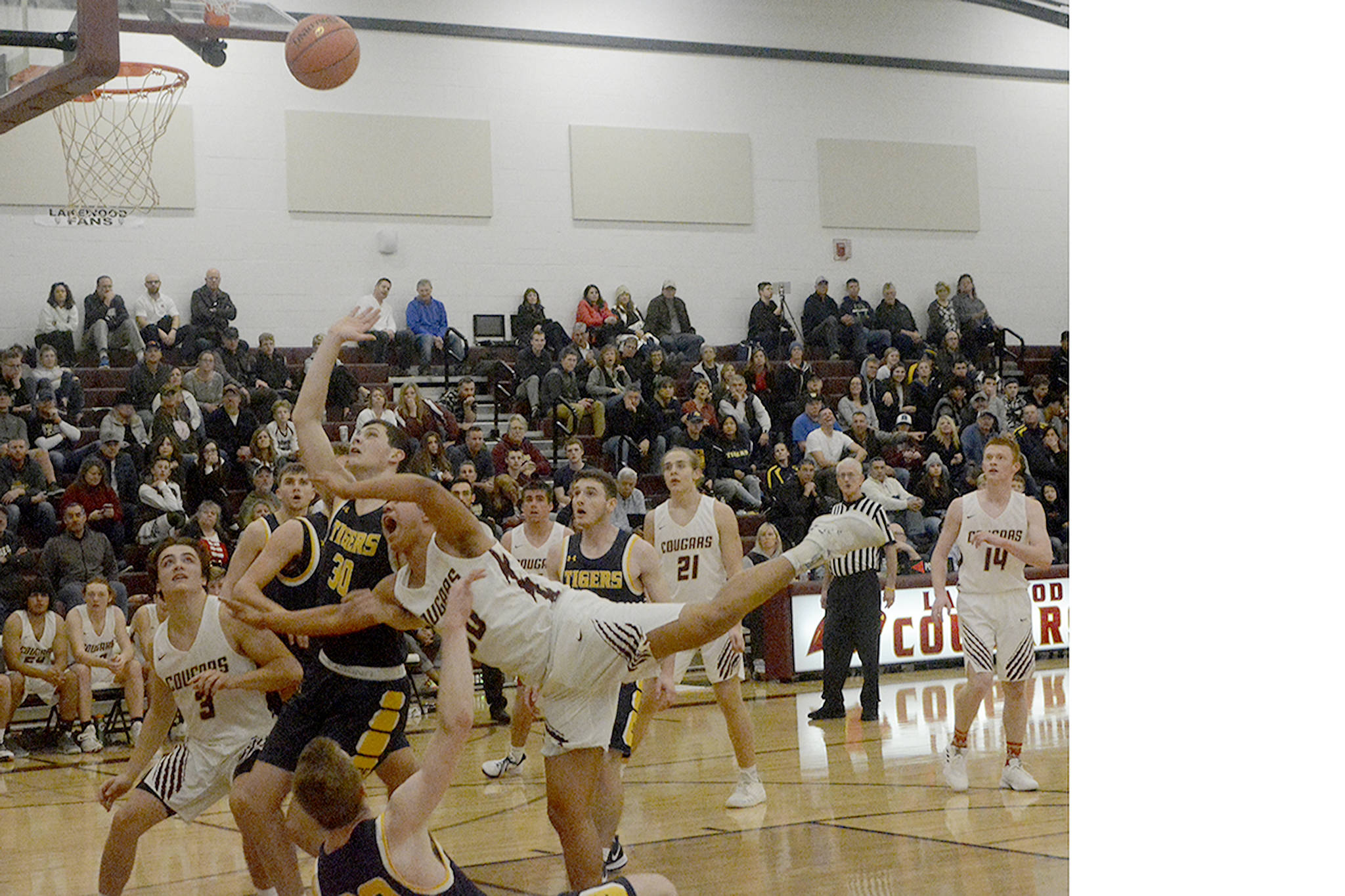 Morgan Stacey loses his balance after colliding with a defender. (Steve Powell/Staff Photos)