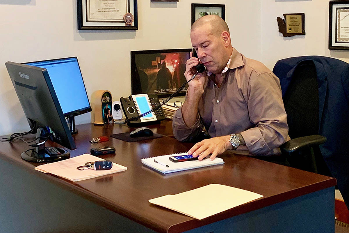 Mike Rocha, bail agent and manager of the Everett office of All City Bail Bonds, says agents often play various roles in a client’s life, with the idea of helping them get on track. Photo by Mackenzie Schwartz/Sound Publishing