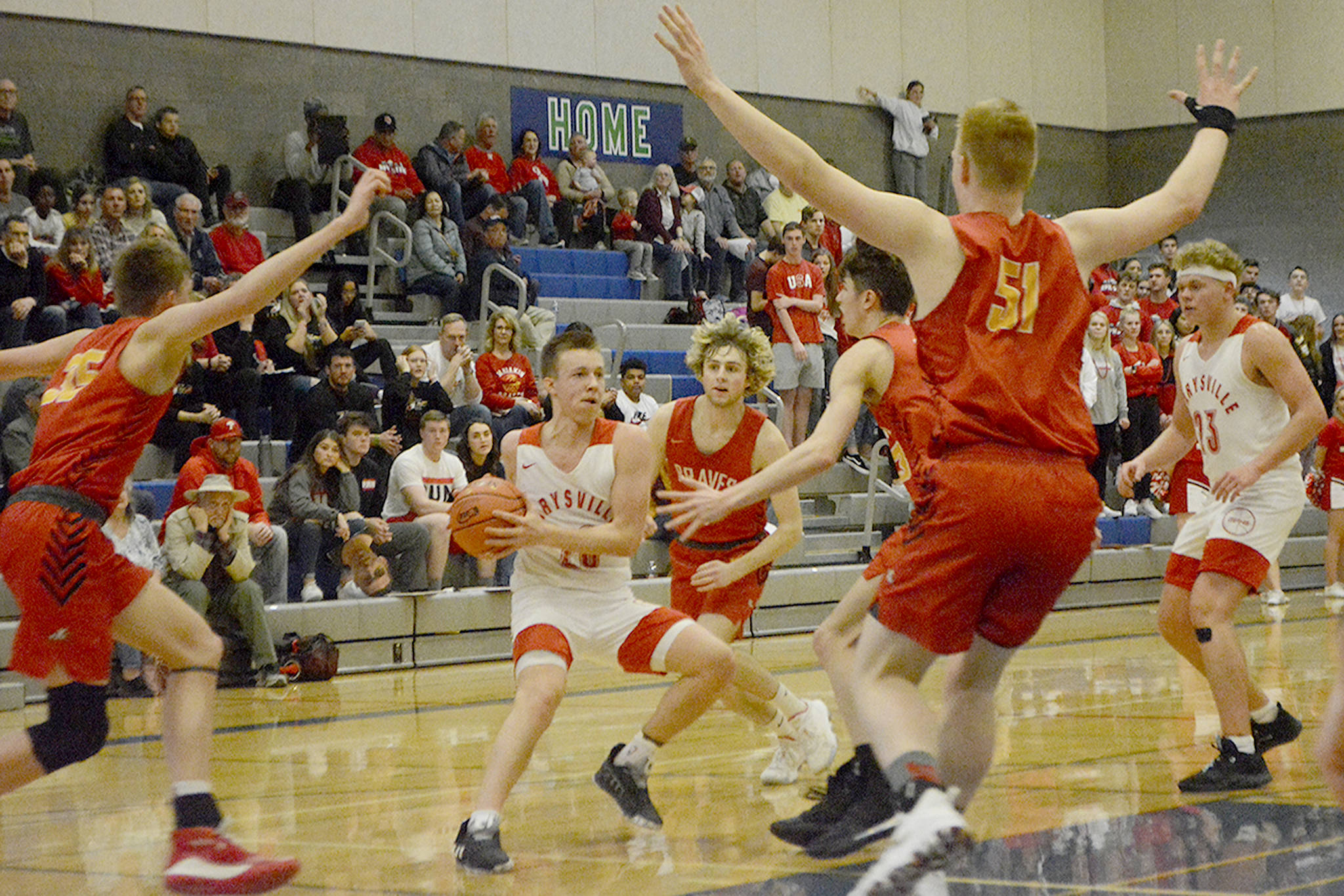 Luke Dobler is surrounded by Brave defenders.