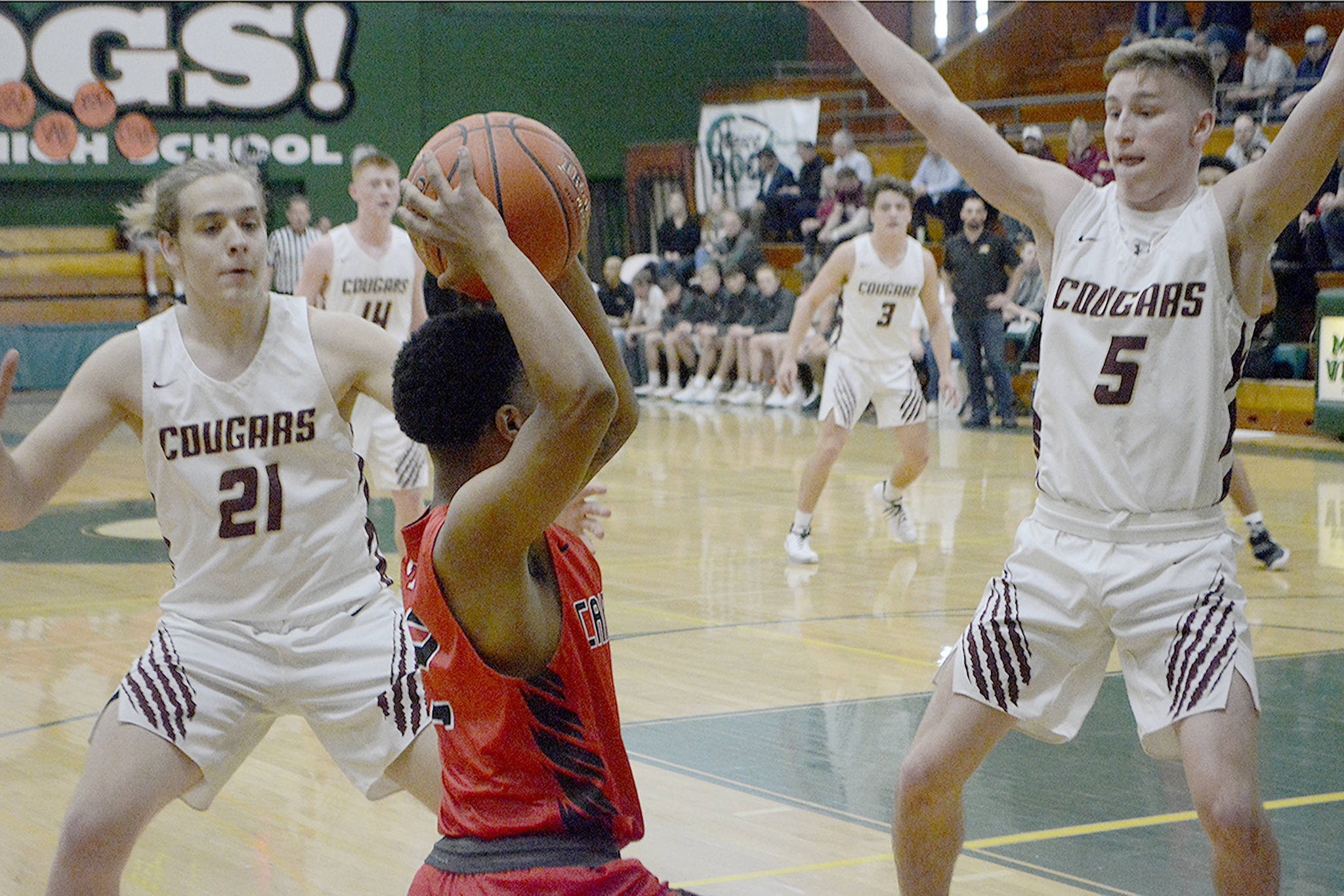 Blake Conyers and Shae Dixon double team the ball on the press. Lakewood’s defense sparked the comeback. (Steve Powell/Staff Photos)