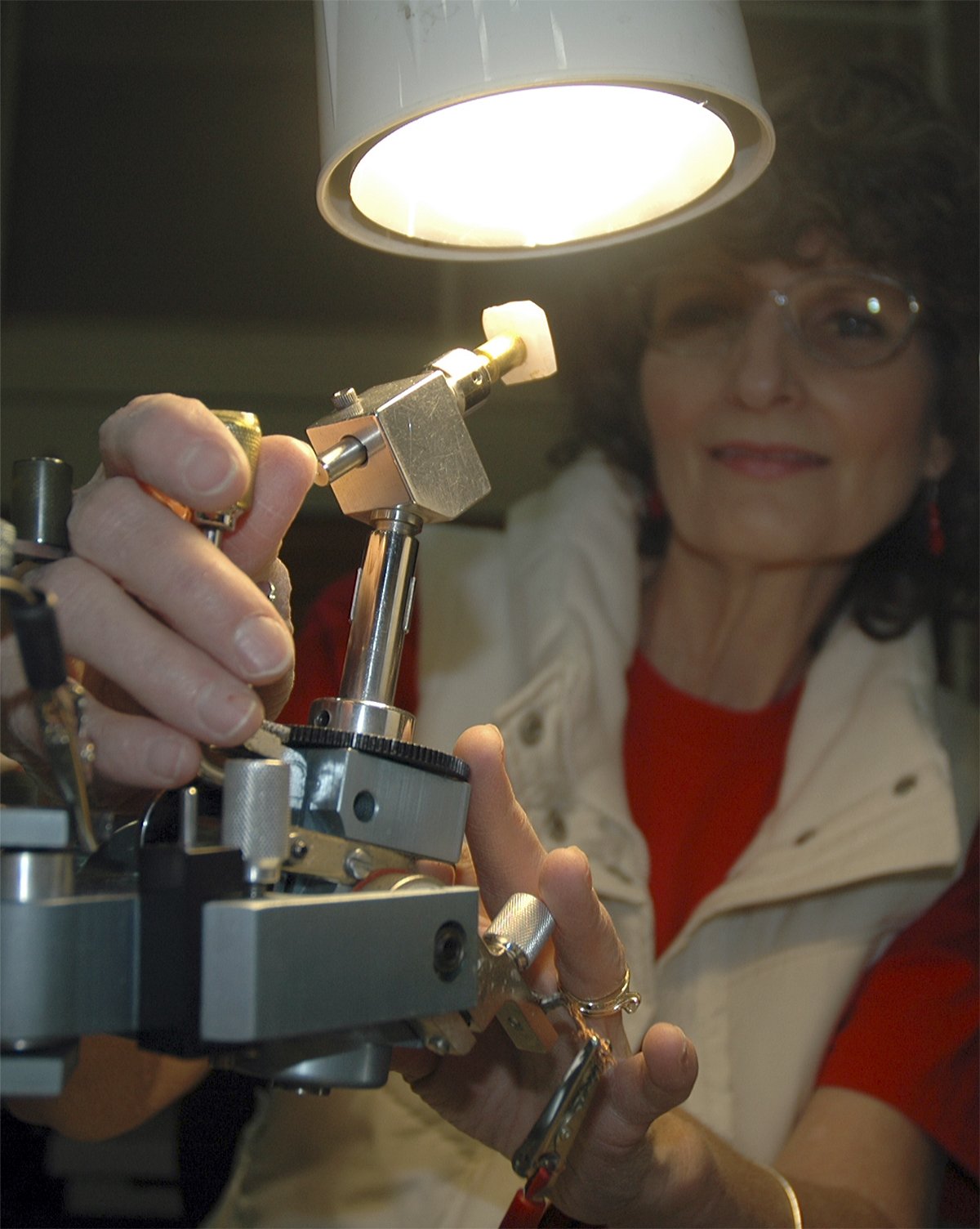 Kirk Boxleitner/Staff PhotoArlington’s Susan Ingram checks her faceting work on a stone at the Marysville Rock & Gem Club’s “Rocktoberfest” Oct. 1.