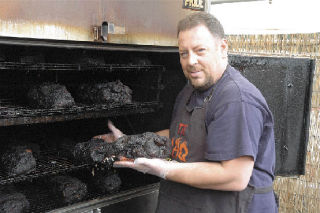 Kelly Jermyn said the care he took in selecting a cooker for his restaurant is one key to the taste of his food. The pork butts slow-cooking here are his most popular item.