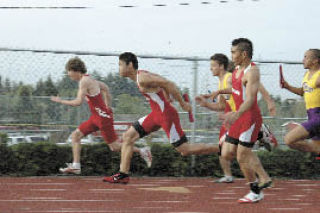 M-P sophomore Mark Pangilinan takes the handoff from junior Andy Abadam in the boys 4x100 relay finals in which the Tomahawks placed third.